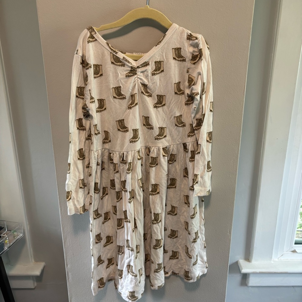 Kate Quinn Cream Dress with Brown ice skate Print 7 skating